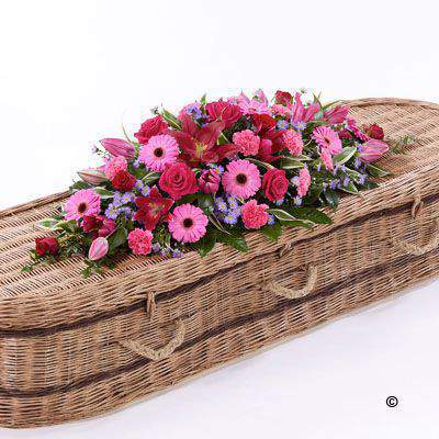 <h2>Large Bright Casket Spray | Funeral Flowers</h2>
<ul>
<li>Approximate Size 50cm x 150cm (5ft)</li>
<li>Hand created classic pink, cerise and red large casket spray in fresh flowers</li>
<li>To give you the best we may occasionally need to make substitutes</li>
<li>Funeral Flowers will be delivered at least 2 hours before the funeral</li>
<li>For delivery area coverage see below</li>
</ul>
<br>
<h2>Liverpool Flower Delivery</h2>
<p>We have a wide selection of casket flowers offered for Liverpool Flower Delivery. Casket flowers can be provided for you in Liverpool, Merseyside and we can organize Funeral flower deliveries for you nationwide. Funeral Flowers can be delivered to the Funeral directors or a house address. They can not be delivered to the crematorium or the church.</p>
<br>
<h2>Flower Delivery Coverage</h2>
<p>Our shop delivers funeral flowers to the following Liverpool postcodes L1 L2 L3 L4 L5 L6 L7 L8 L11 L12 L13 L14 L15 L16 L17 L18 L19 L24 L25 L26 L27 L36 L70 If your order is for an area outside of these we can organise delivery for you through our network of florists. We will ask them to make as close as possible to the image but because of the difference in stock and sundry items it may not be exact.</p>
<br>
<h2>Liverpool Funeral Flowers | Casket Flowers</h2>
<p>This bright large casket spray has been loving handcrafted by our expert florists. Featuring a classic selection of flowers in pink, red and cerise including large-headed roses, carnations, gerberas and Oriental lilies complemented by luscious green foliage.</p>
<br>
<p>Funeral Casket Flowers the main tribute and are sometimes, depending on the family's wishes, the only flower arrangement. They are usually chosen by the immediate family.</p>
<br>
<p>Casket sprays are placed directly on top of the coffin. They range from 3ft - 6ft. Smaller sizes will often be selected if there are other items to go on the coffin with the spray.</p>
<br>
<p>The sprays are large diamond shape tributes. The flowers are arranged in floral foam, which means the flowers have a water source meaning they look their very best for the day.</p>
<br>
<p>Large size contains 5 cerise large-headed roses, 5 red large-headed roses, 8 cerise gerberas, 4 pink Oriental lilies, 5 lilac Septemer flower, 10 cerise carnations and seasonal mixed foliage.</p>
<br>
<h2>Best Florist in Liverpool</h2>
<p>Trust Award-winning Liverpool Florist, Booker Flowers and Gifts, to deliver funeral flowers fitting for the occasion delivered in Liverpool, Merseyside and beyond. Our funeral flowers are handcrafted by our team of professional fully qualified who not only lovingly hand make our designs but hand-deliver them, ensuring all our customers are delighted with their flowers. Booker Flowers and Gifts your local Liverpool Flower shop.</p>
<br>
<p><em>Janice Crane - 5 Star Review on Google - Funeral Florist Liverpool</em></p>
<br>
<p><em>I recently had to order a floral tribute for my sister in laws funeral and the Booker Flowers team created a beautifully stunning arrangement. Thank you all so much, Janice Crane.</em></p>